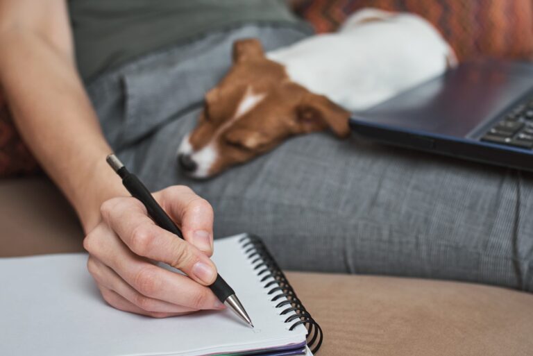 woman-write-plans-notebook-with-her-jack-rusel-terrier-puppy-dog-good-relationships-friendship-owner-animal-pet-scaled-1